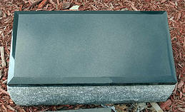 This is a gray and black, single cremation memorial.