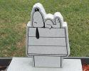 This is a gray, single monument, in a sleeping snoopy style.